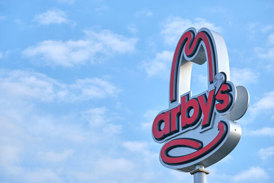 Arby's restaurant sign against sky in Eerie, PA on September 19, 2022.