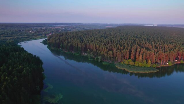 Flight along a river flowing through a forest
