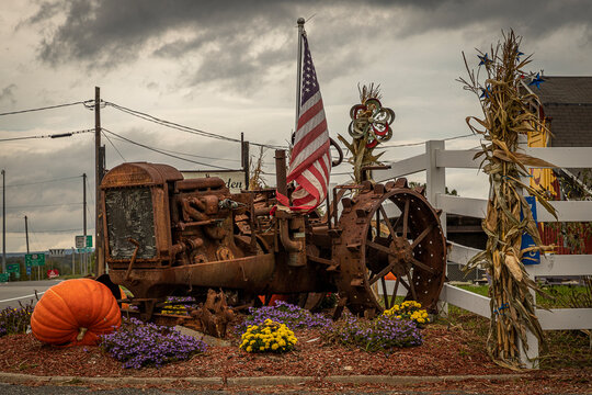 Antique Tractor At A Farm Stand Decorated For Fall Festival