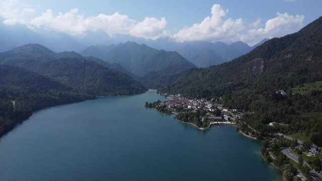 Scenic aerial footage of Barcis, Italy. Fascinating aerial views of Barcis Village, Lake Barcis and Dolomites mountains (Alps).