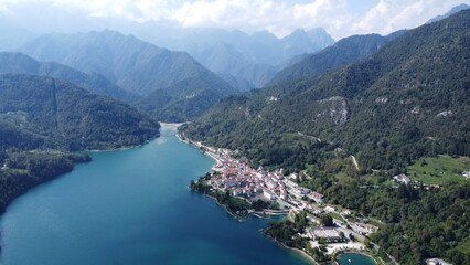 Scenic aerial footage of Barcis, Italy. Fascinating aerial views of Barcis Village, Lake Barcis and Dolomites mountains (Alps).