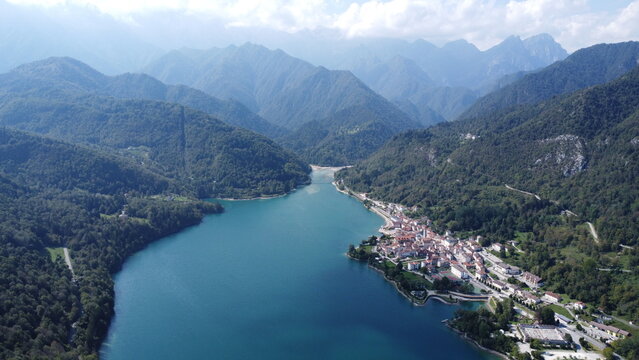 Scenic aerial footage of Barcis, Italy. Fascinating aerial views of Barcis Village, Lake Barcis and Dolomites mountains (Alps).