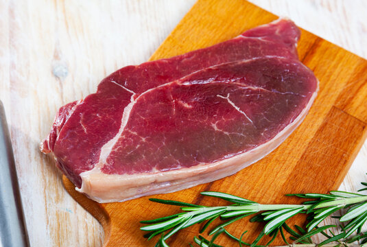 Raw horsemeat fillet with rosemary. High quality photo