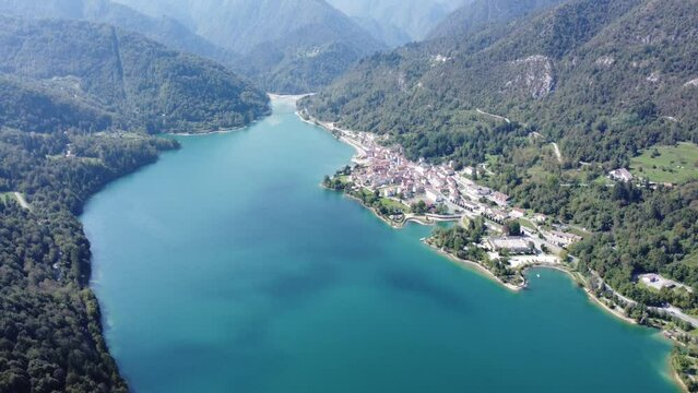 Scenic aerial footage of Barcis, Italy. Fascinating aerial views of Barcis Village, Lake Barcis and Dolomites mountains (Alps).