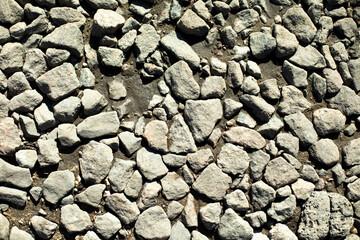 Rocks on road. Fine stone texture.