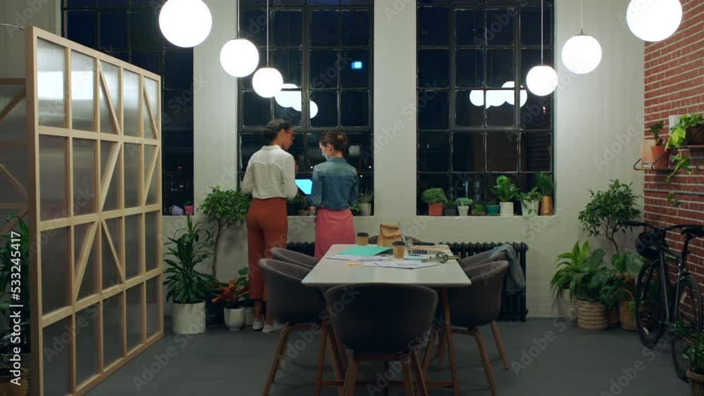 Aufkleber creative team, working late and holding tablet while talking and planning on the internet, mobile ap