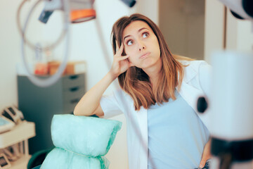 Stressed Unhappy Dentist Feeling Overwhelmed and Confused. Sad and tired healthcare worker feeling...