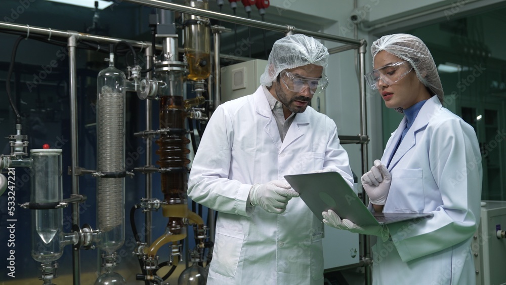 Poster two scientist in professional uniform working in laboratory for chemical and biomedical experiment