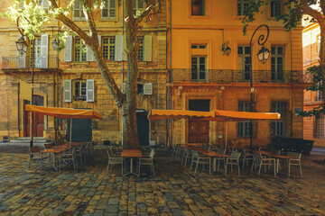 View of Provence typical city Aix en Provence with old house facade and famous old fountain in the morning