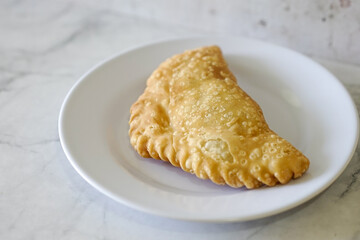 Cornish pasty filled with chicken and potato. Pastry minced pie or Pastel asian style cuisine. Homemade flaky pasty with mince meat filling	
 - obrazy, fototapety, plakaty