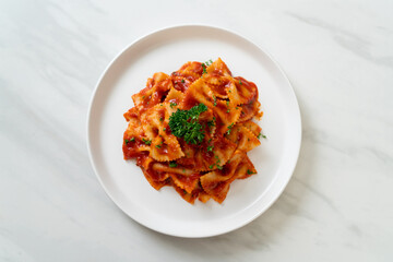 farfalle pasta in tomato sauce with parsley