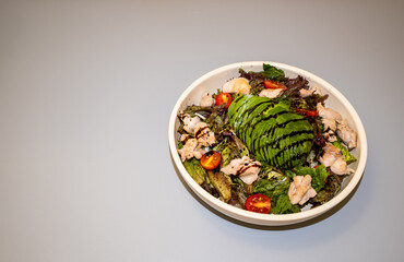 Round  Tray and avocado salad on dark fabric Surface copy space for design text 45 degree foodie