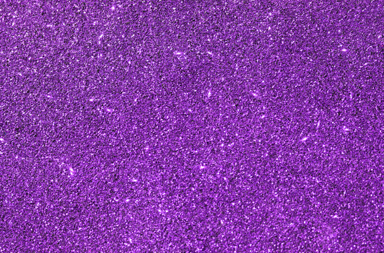 Purple glitter light background.  Photo can be used for New Year, Christmas and all celebrations backgrounds concepts.