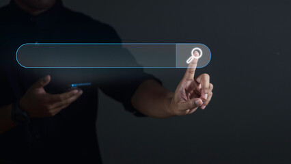 Search Engine Optimization SEO Networking Concept. Businessman using smartphone and touching search icon on virtual screen.