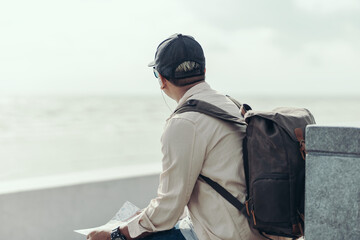 Tourists hold maps to find attractions, restaurants or hotels. backpacker and travel concept.