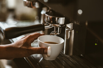 Fototapeta na wymiar espresso machine in coffee shop counter offering freshly brewed coffee. coffee maker concept.