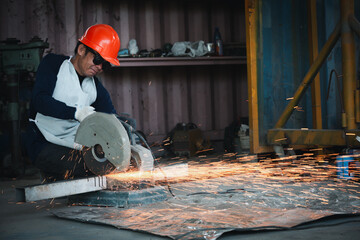 Cutting of a steel with splashes of sparks  in the industrial shop.