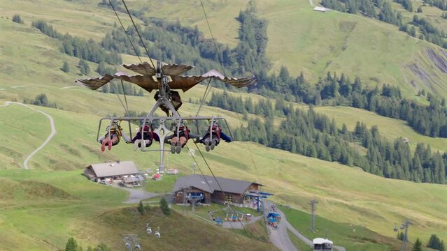 Four people riding the Grindelwald first glider in Switzerland