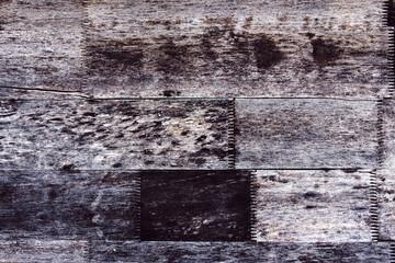 Close up to old dirty finger joint at end of wood sticks. Woodworking of zigzag at end of the...