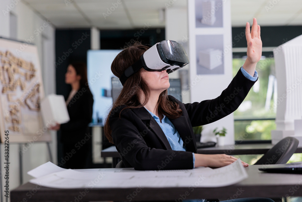 Aufkleber architect in ar helmet touching virtual building model, working on project in metaverse. employee en
