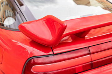 Close up of rear spoiler on sports car.