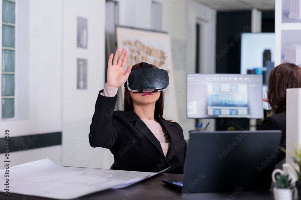 Poster architect working on project blueprints wearing vr helmet in architecture office. employee engineeri
