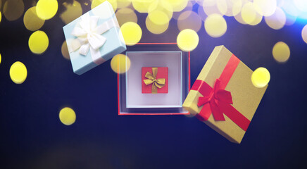 Christmas decoration. Gift boxes on black stone  background. Christmas greeting card concept.