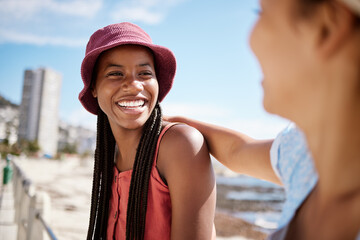 Black woman, summer and bonding with friends by beach, ocean and sea in Miami, Florida. Smile,...