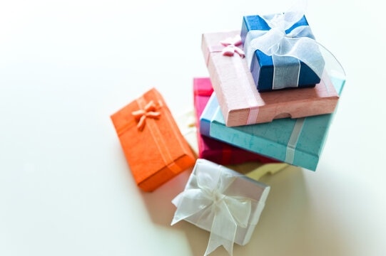 Stack of colorful gift box on table.