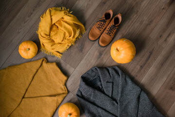 Autumn warm clothes and pumpkins