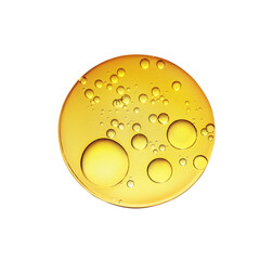 Golden yellow abstract oil bubbles or face serum isolated on white background. Oil bubbles macro photography.