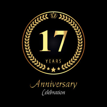 17th anniversary logo with golden laurel wreaths, gold crown, and gold star isolated on black background. Premium design for happy birthday, weddings, greetings card, poster, graduation, ceremony.
