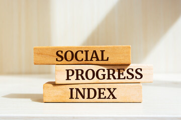 Wooden blocks with words 'SOCIAL PROGRESS INDEX'. Business concept