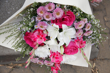 Bright school bouquet with roses, lilies,  chrysanthemum