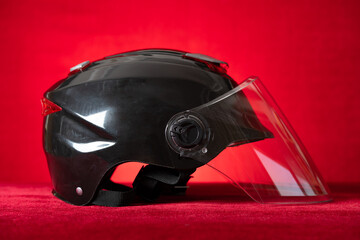 brand new motobike helmet on a red background