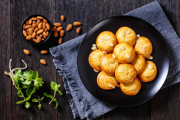 almond cookies on black plate, top view