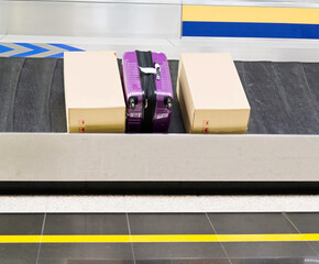 Group of suitcases on conveyor belt of airport