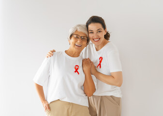 Smiling women with red satin ribbon