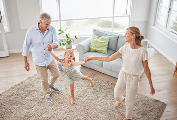 Family or grandparents dancing with child in living room for wellness, healthy body movement and...