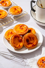 Egg tart, traditional Portuguese dessert, pastel de nata. Pasteis de Belem is a Portuguese egg custard tart pastry dusted with cinnamon.