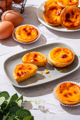 Egg tart, traditional Portuguese dessert, pastel de nata. Pasteis de Belem is a Portuguese egg custard tart pastry dusted with cinnamon.
