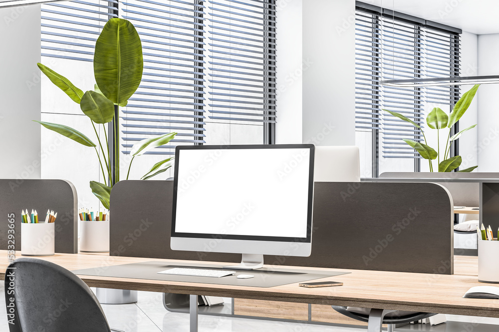 Poster perspective view on blank white monitor on wooden table with black partition in sunlit coworking off