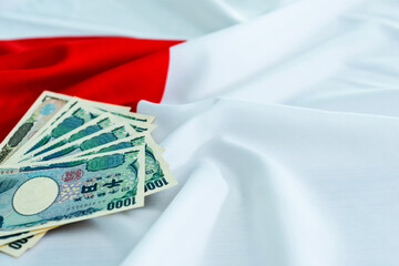 Cash money on japanese flag