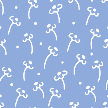 Floral boho seamless pattern with white daisies and polka dots on blue background in doodle style © Оксана Назарова