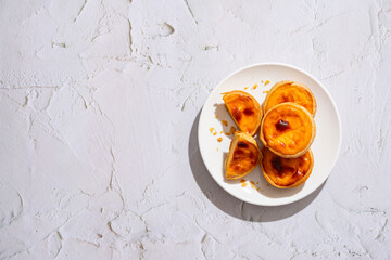 Egg tart, traditional Portuguese dessert, pastel de nata. Pasteis de Belem is a Portuguese egg custard tart pastry dusted with cinnamon.