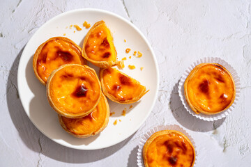Egg tart, traditional Portuguese dessert, pastel de nata. Pasteis de Belem is a Portuguese egg custard tart pastry dusted with cinnamon.
