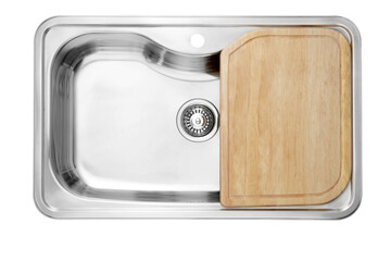 Top view of an empty sink with .wooden cutting boards..