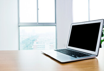 Sinlge laptop on table in office