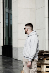 Fototapeta premium man in hoodie and cool haircut
