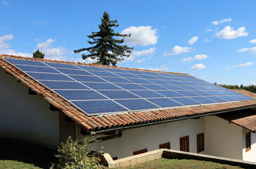 Solar panels on the roof of a house in the mountain.